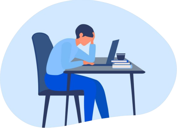 Person sitting at a desk with a laptop, head resting on hand, appearing stressed or tired.