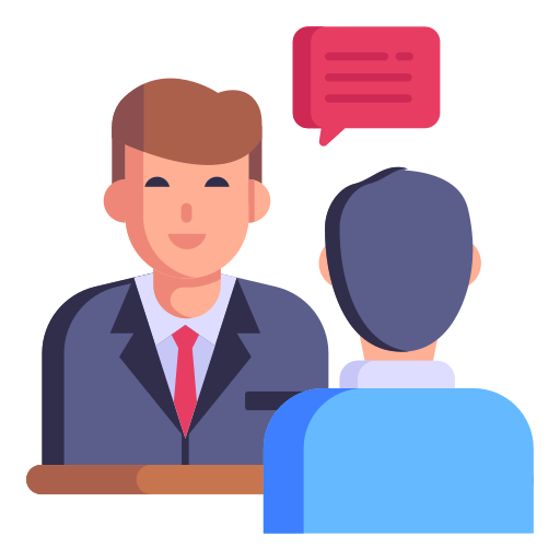 Two people sit across a desk, one talking and the other listening, with a speech bubble above them.