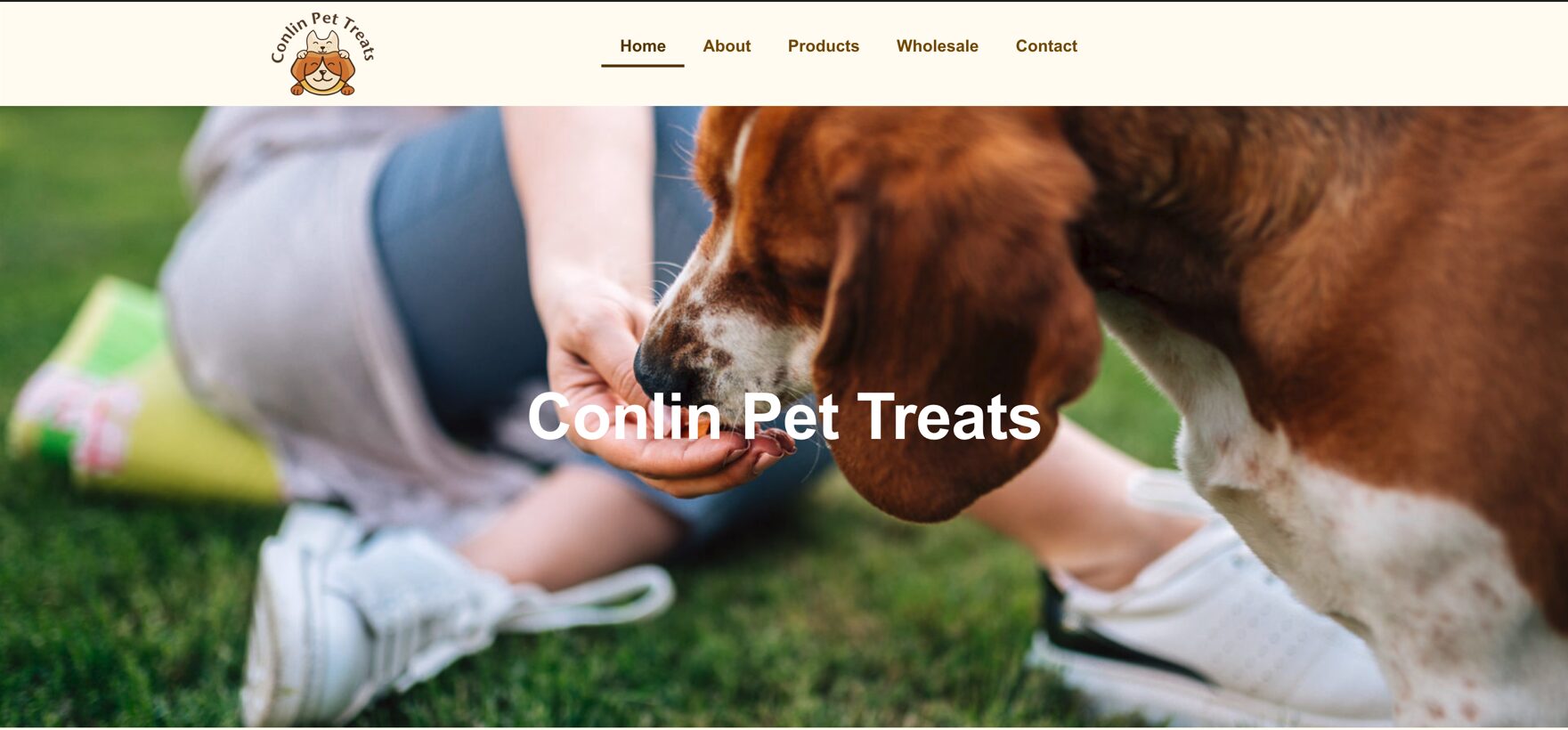 Person feeding a brown and white dog treats on grass, with Conlin Pet Treats text overlayed.